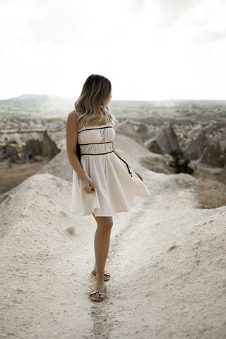 Alice cream and black tie dress