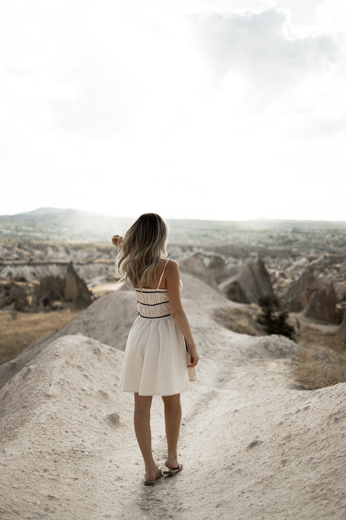 Alice cream and black tie dress