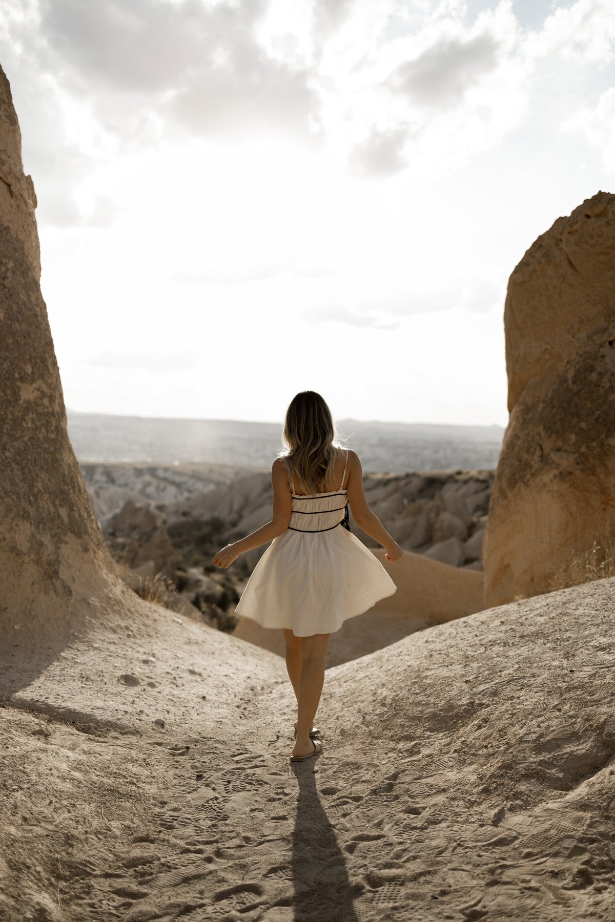 Alice cream and black tie dress